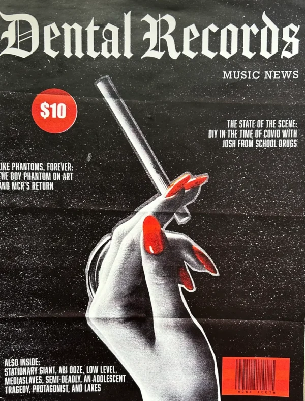 A magazine cover with a hand holding a pen.